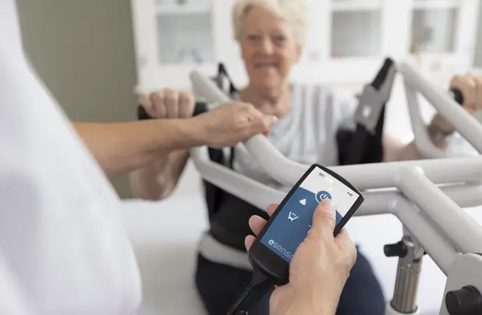 Accurate positioning with the compact esense Rise active patient lift with electric drive wheel